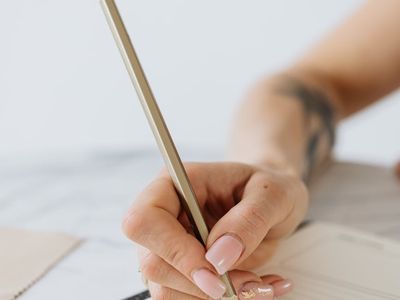 Close-up of a hand gripping a dumbbell with focused intent.